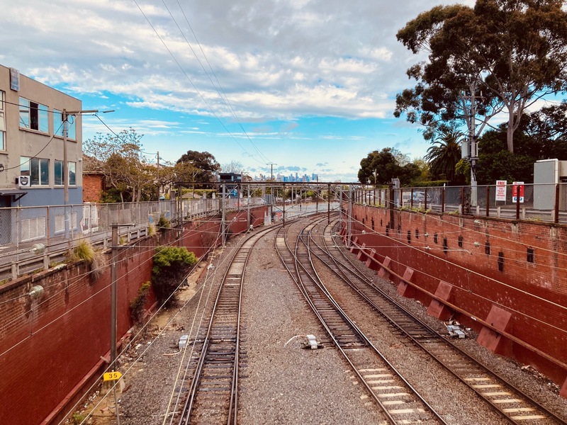 Sunken train tracks in Melbourn's Camberwell Junction. The Melbourne skyline in the distance